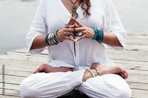 Tableau sur toile woman hand in yoga symbolic gesture mudra