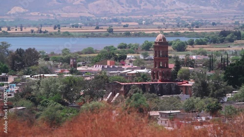 Village in the suburbs of the city Teuchitlan, Mexico. Landscape of Mexican village, a temple on a background of lake and mountains photo