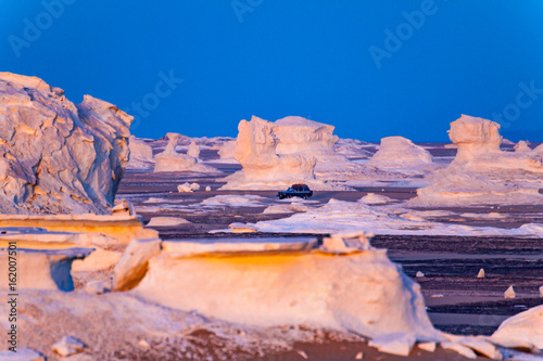 The dazzling and colored twilight of the white Desert. photo