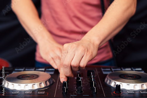 The hands of the DJ