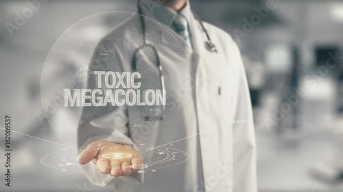 Doctor holding in hand Toxic Megacolon photo