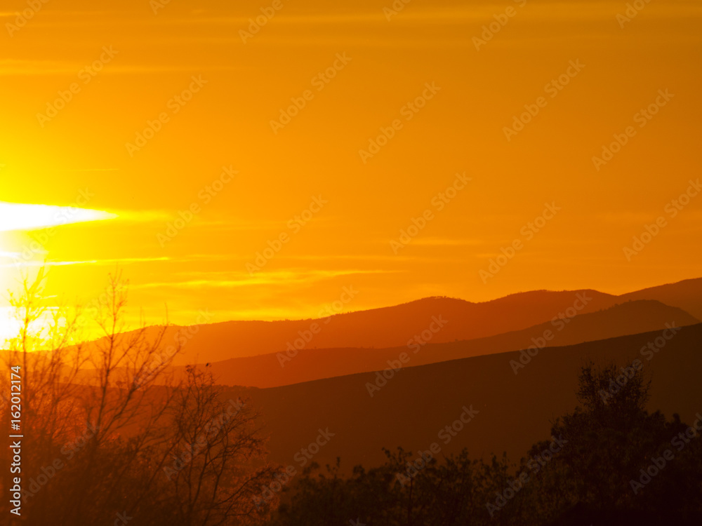 Landscape of mountains at sunset with orange sky in Spain Landscape of mountains at sunset with orange sky in Spain