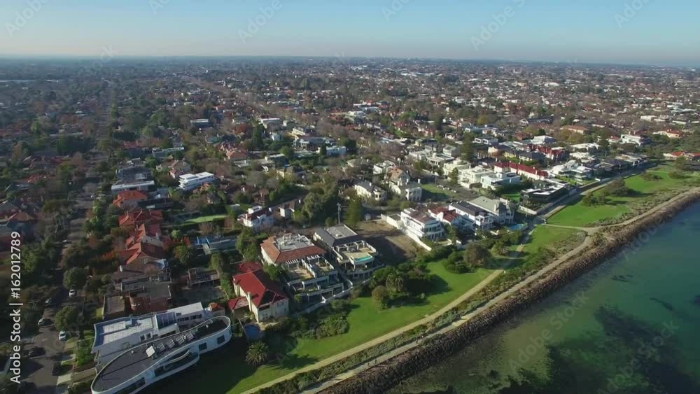 Aerial pan across Melbourne suburbs along the coastline on bright sunny day Aerial pan across Melbourne suburbs along the coastline on bright sunny day