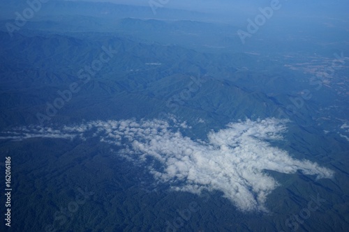 Aerial photos Shows lots of clouds like the sea. And the atmosphere of the airport. Including downtown Chiang Mai.