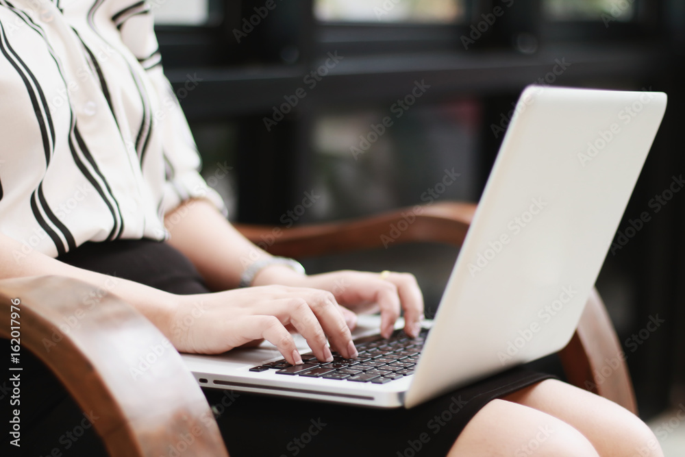 Beautiful business woman sitting on office and working on laptop. Beautiful business woman sitting on office and working on laptop.