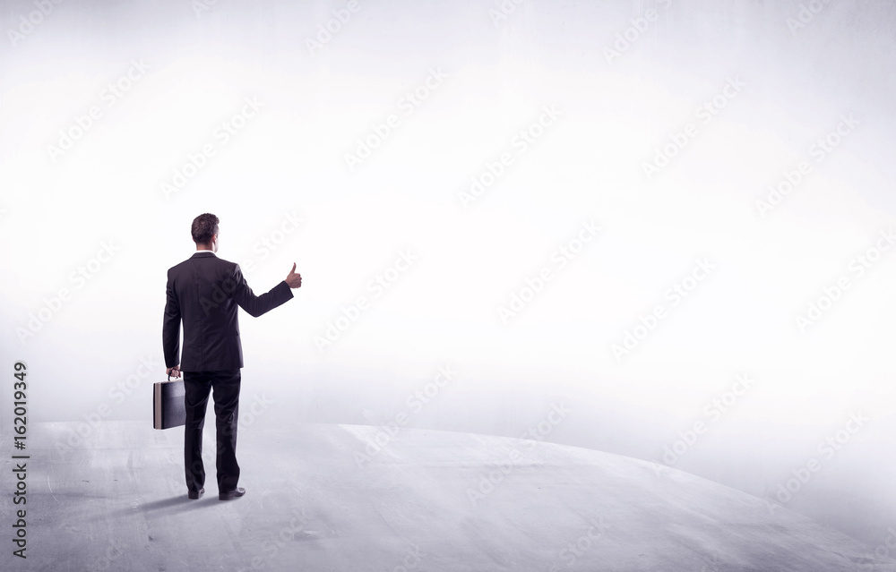 Business person standing from rear view Business person standing from rear view