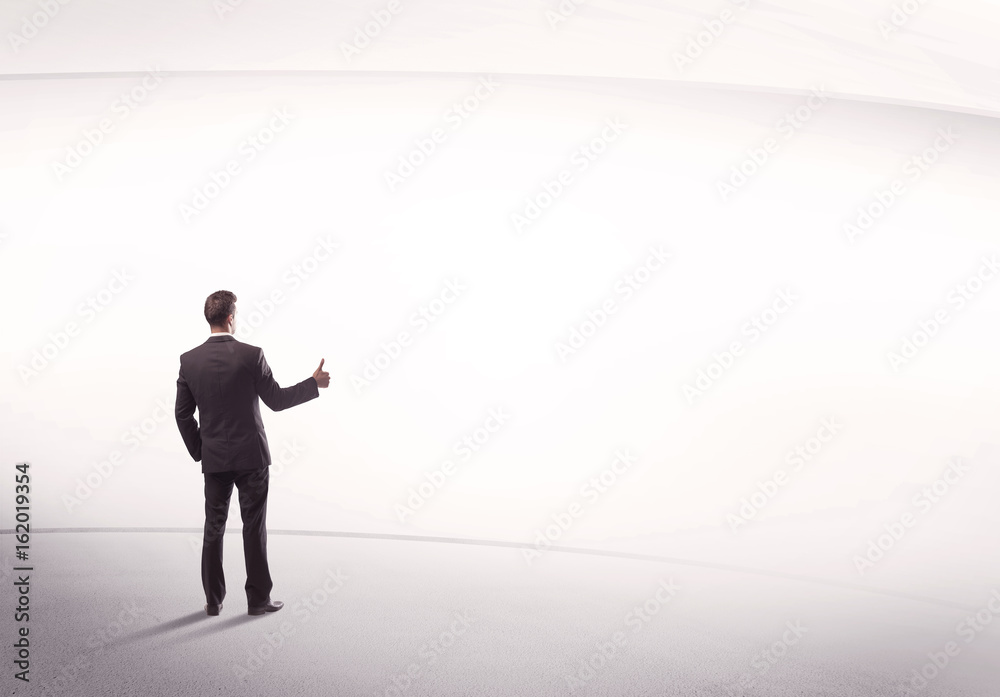 Businessman with briefcase standing still