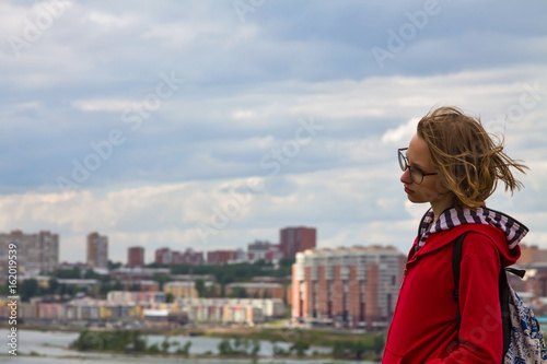 Teenage girl with view of city