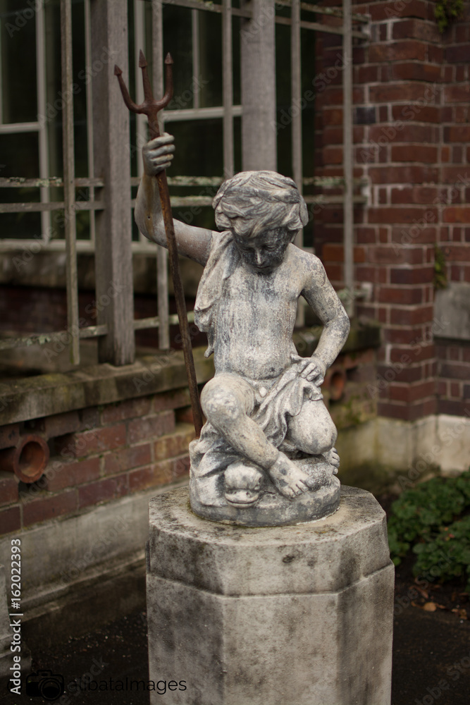 boy statue with scepter