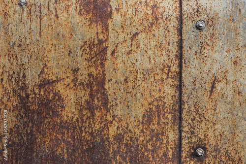 Rusty metal plate texture with bolts © smakhalov