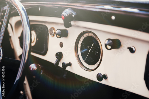 Interior view of classic vintage car. Instagram toning. Beautiful retro car poster, postcard.