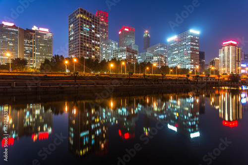 River And Modern Buildings Against Sky at night in Tianjin,China. © fanjianhua