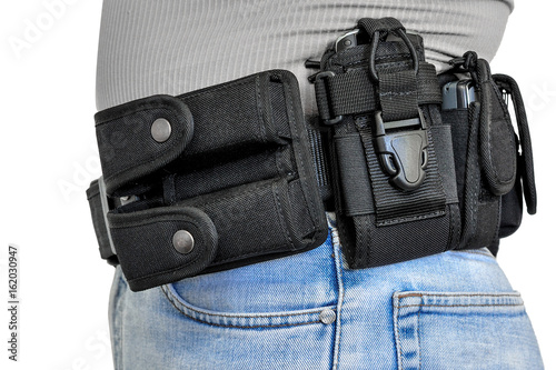 Military tactical belt with semi-automatic buckle for connection with cartridge pouch, placed on man's belt, isolated - side view