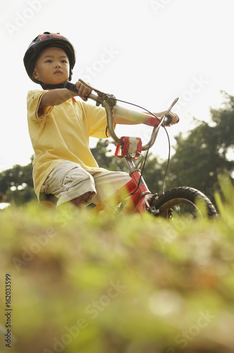 Boy riding bicycle © eskay lim