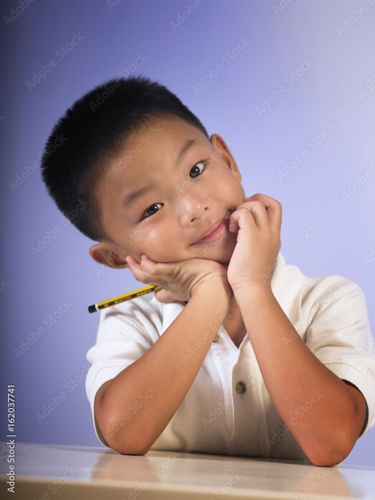 boy tilted his head while posing to camera boy tilted his head while posing to camera