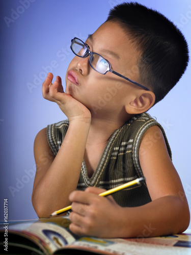 boy pushing his chin up photo