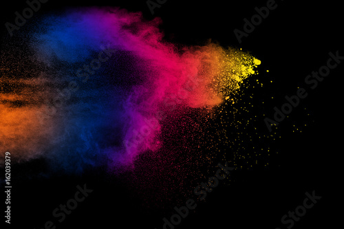 abstract multicolored powder splatted on black background,Freeze motion of color powder exploding © Pattadis