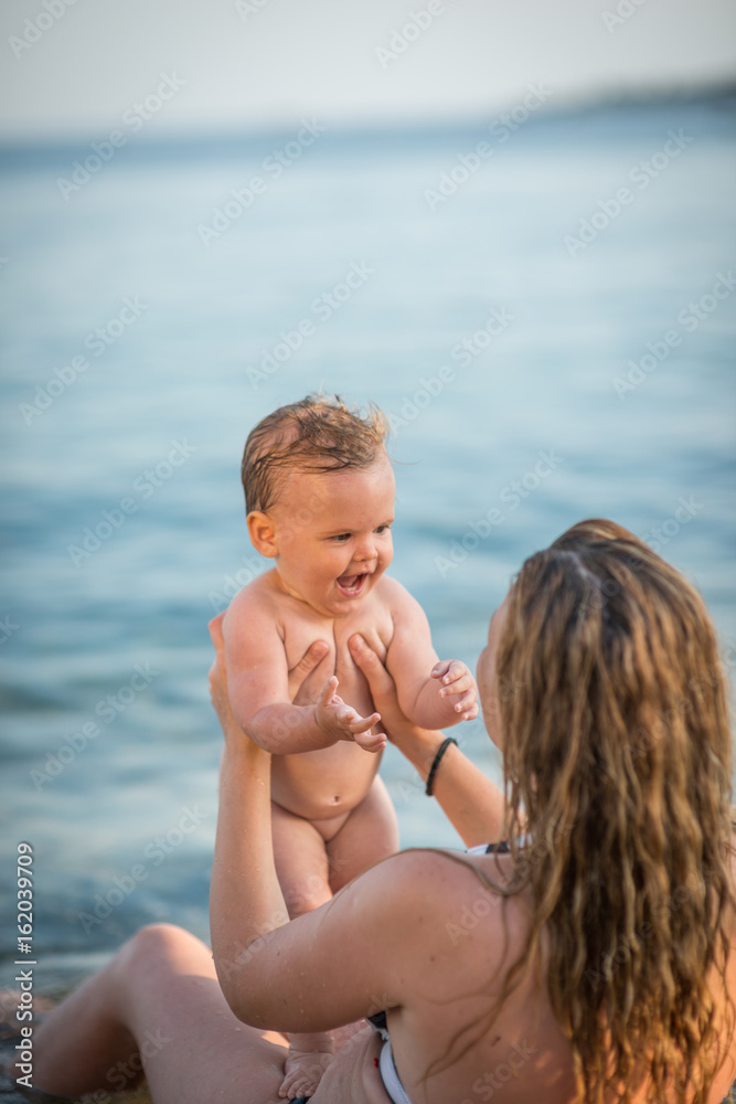 Happy family resting at beach in summer Happy family resting at beach in summer