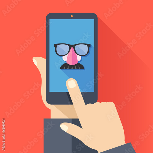 VPN app, anonymous proxy. Hand holds smartphone, disguise mask on screen, finger touches screen. Anonymity on internet, online privacy, anonymous browsing, proxy browser concept. Vector illustration photo