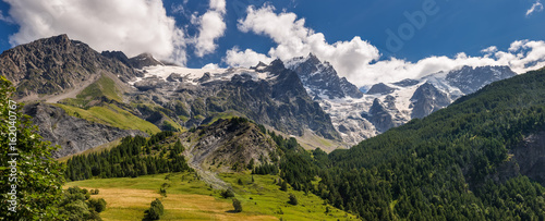 Panoramic Summer view of the mountains and glaciers in Ecrins National Park (La Meije, Glacier du Tabuchet) from the village of La Grave. Hautes-Alpes, PACA Region, Southern French Alps, France