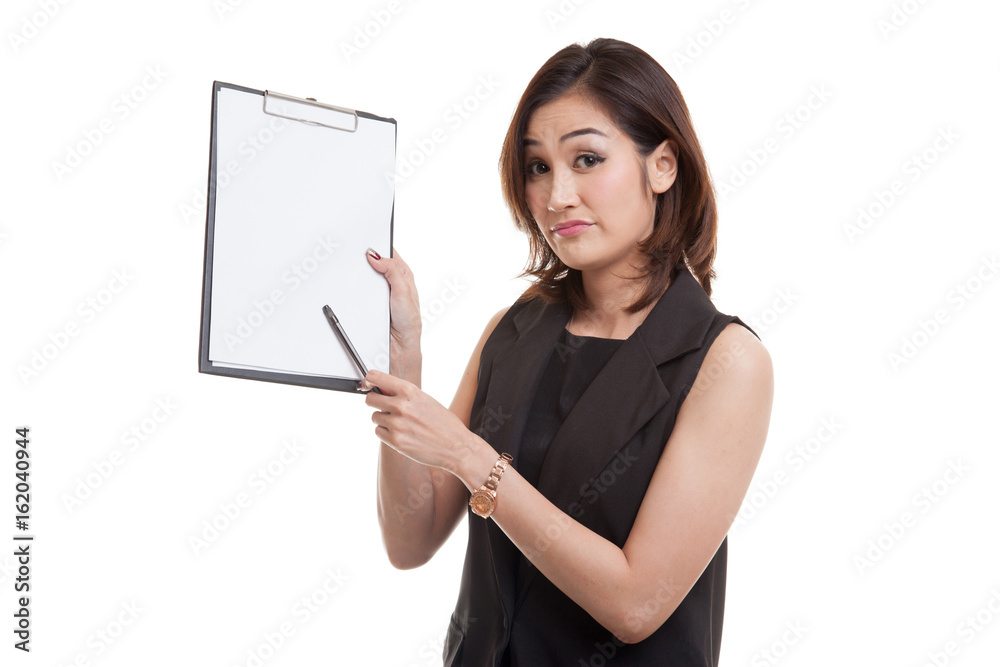 Unhappy Asian business woman point to clipboard with pen. Unhappy Asian business woman point to clipboard with pen.