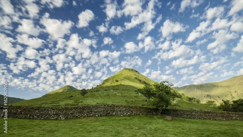 Landscape with Scenic Hills and Stonewall in Lake District UK photo