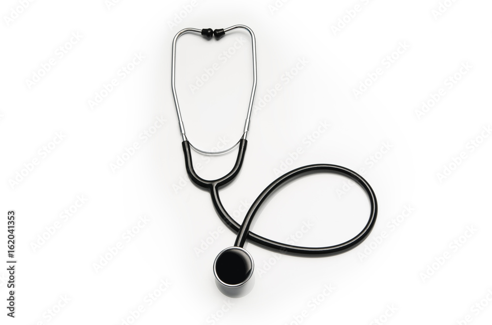Stethoscope isolated on white background. Sterile doctors office desk. Medical accessories on a white table background with copy space around products. Photo taken from above. Stethoscope isolated on white background. Sterile doctors office desk. Medical accessories on a white table background with copy space around products. Photo taken from above.
