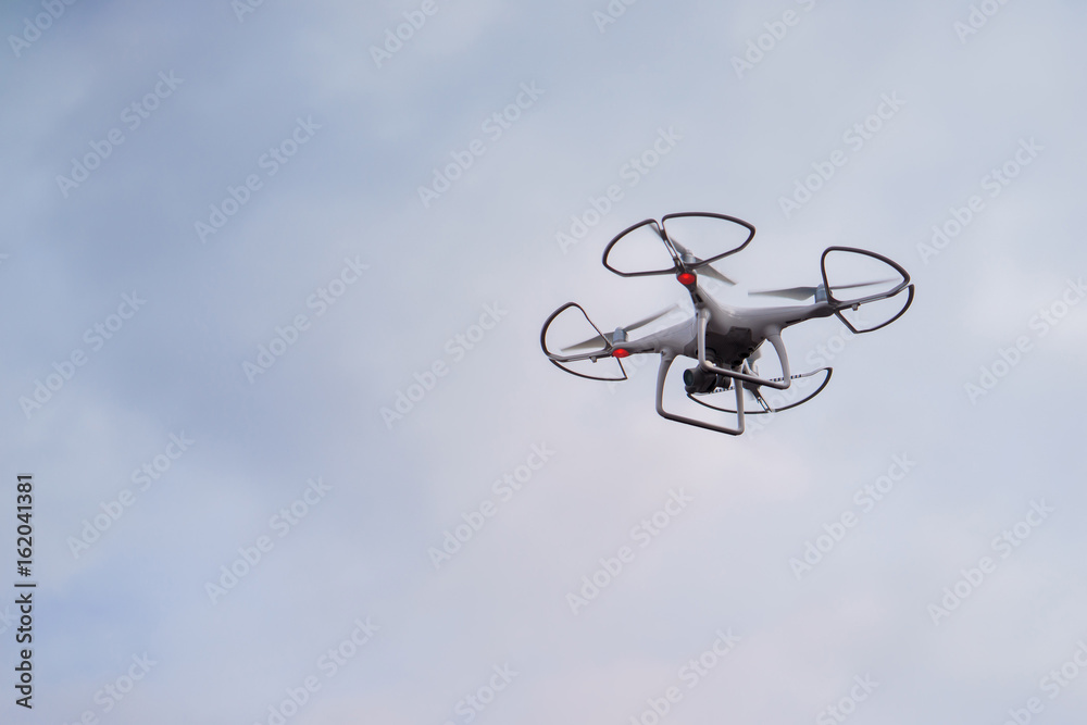 drone in the air against a backdrop of gray sky