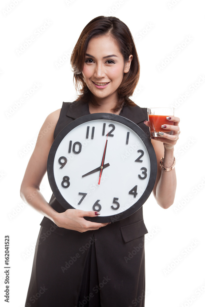 Young Asian woman with tomato juice and clock. Young Asian woman with tomato juice and clock.