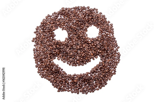Cheerful smiley from coffee beans, isolated on white background
