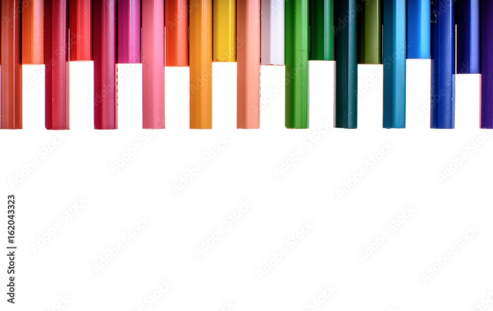Many colored pencils isolated on white background, place for text