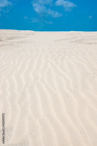 Lines in the sand of a beach. Out of focus image.