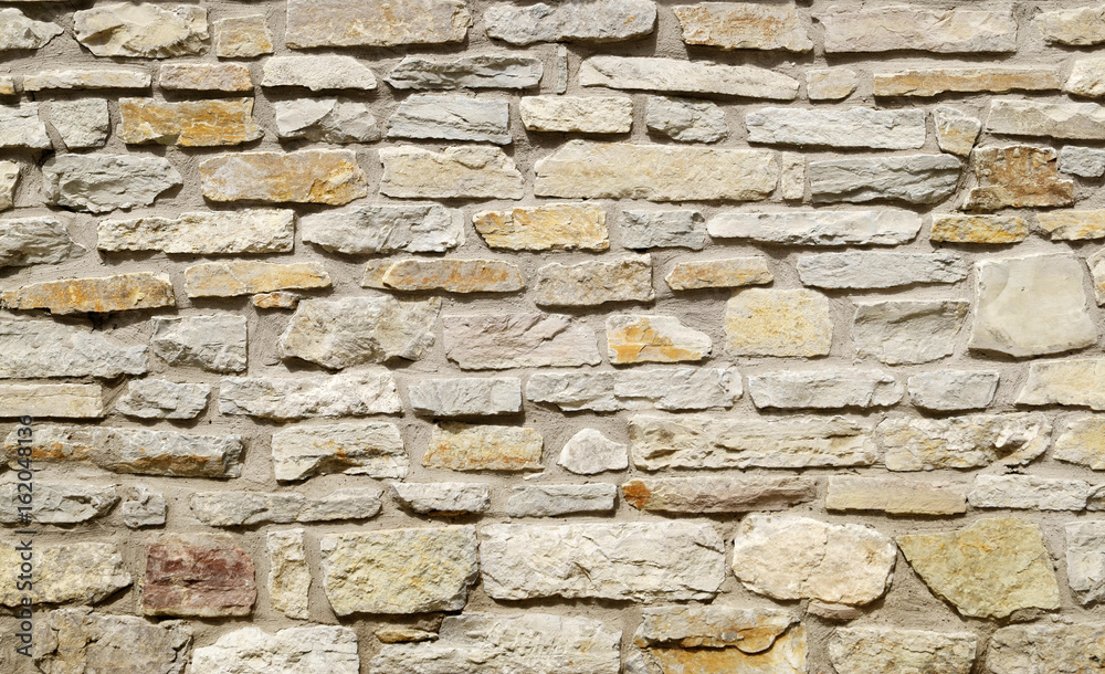 Grey stone wall background. Surface stone wall background.
