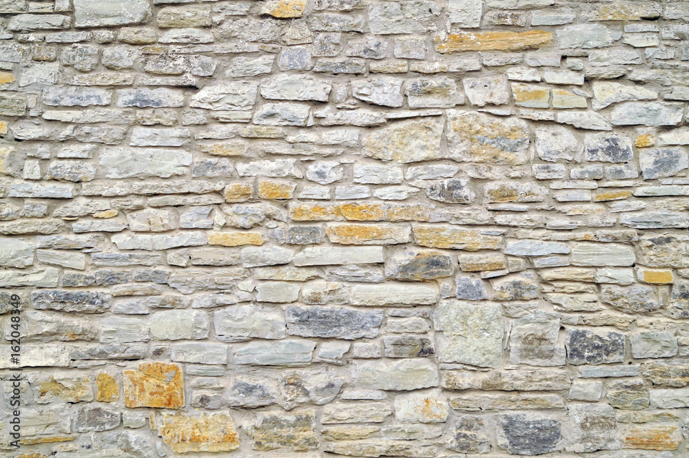 Grey stone wall background. Surface stone wall background.