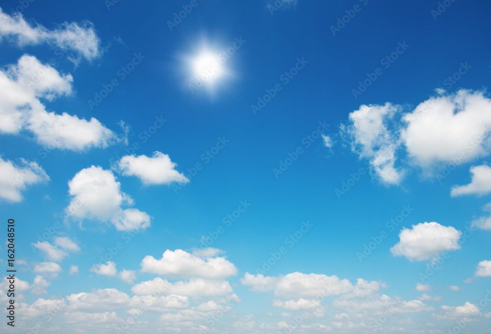 Sun in bright blue sky.