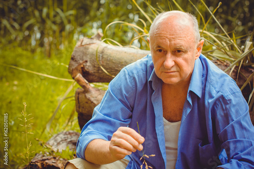Canvas Print A sad mature man thought about the meaning of life and about his problems, depre
