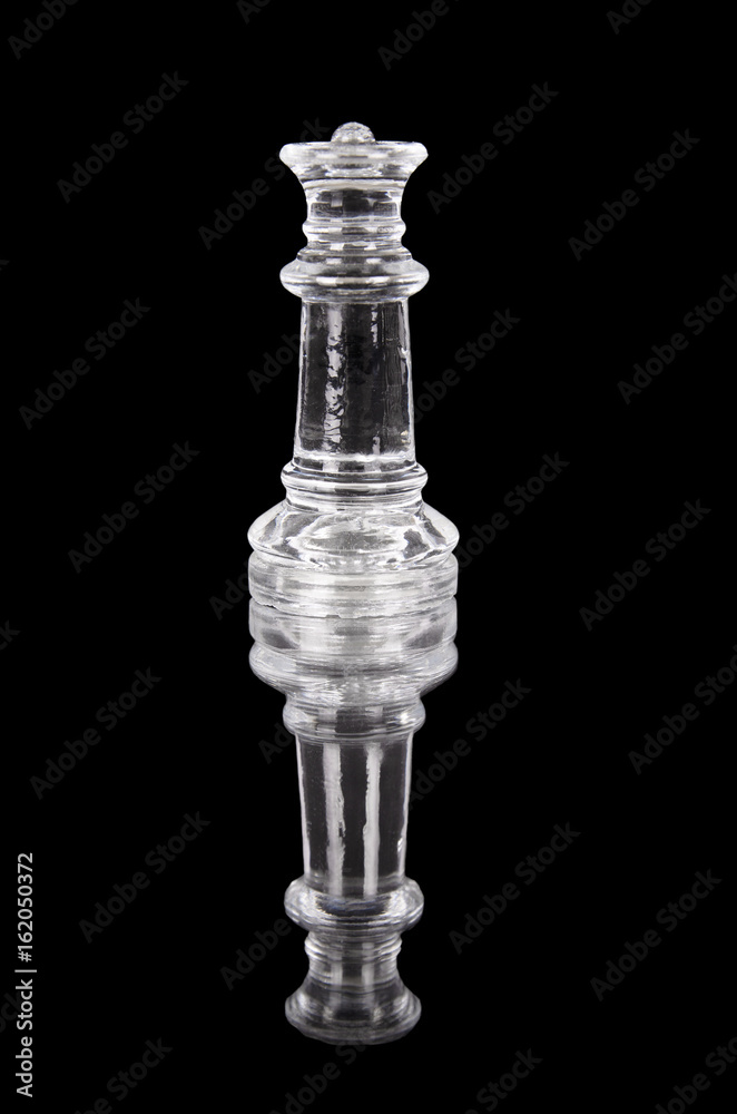 Glass chess queen on black isolated background. Glass chess queen on black isolated background.