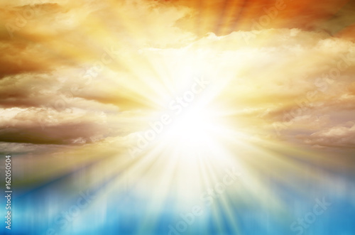 Colored Sunset. Sky with clouds and sun over blue sea