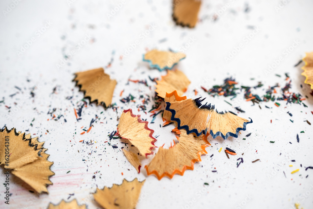 Color pencil shaves on a white paper Color pencil shaves on a white paper