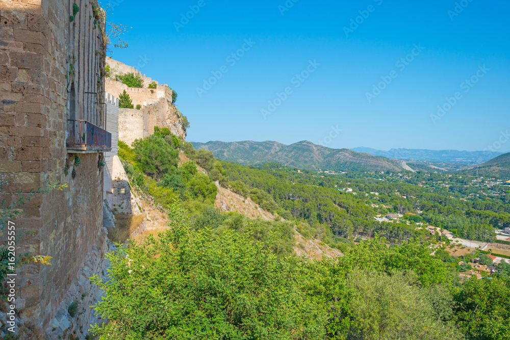 Details of a castle on a hill in sunlight