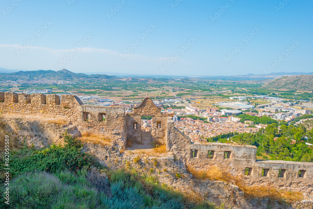 Details of a castle on a hill in sunlight