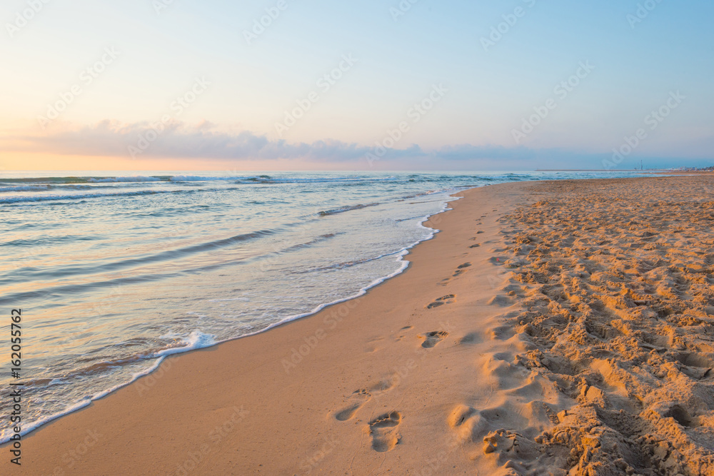 Sunrise over sea and sandy beach in spring Sunrise over sea and sandy beach in spring