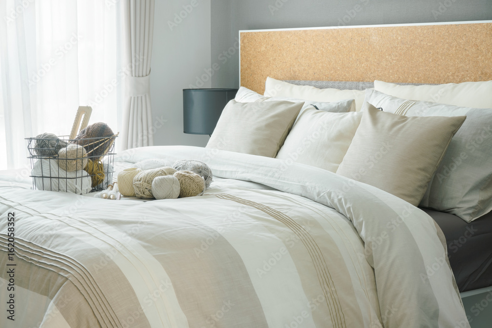 Obraz premium Modern classic interior bedroom with a lot of yarn balls on bed