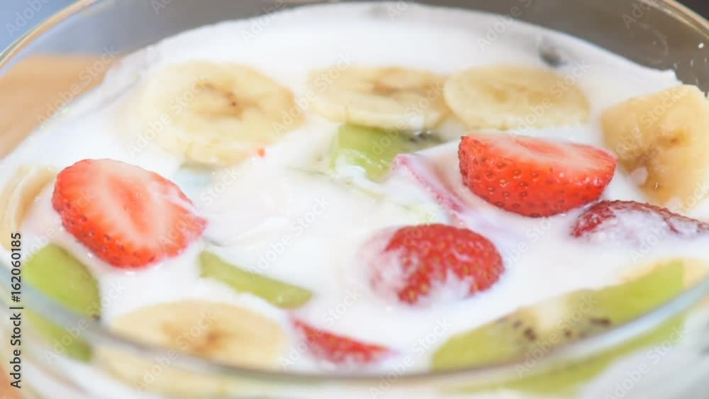 Close-up of healthy fresh berries and white yogurt on the spoon. Concept of healthy food nutrition. Close-up of healthy fresh berries and white yogurt on the spoon. Concept of healthy food nutrition.