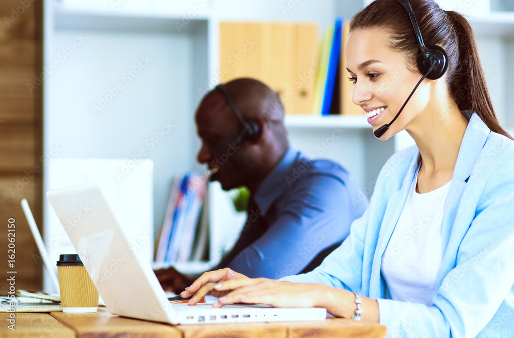 Portrait of an African American young business man with headset.