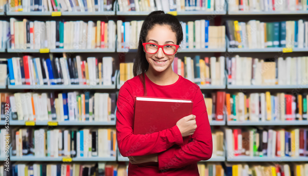 Tennager student in a library Tennager student in a library