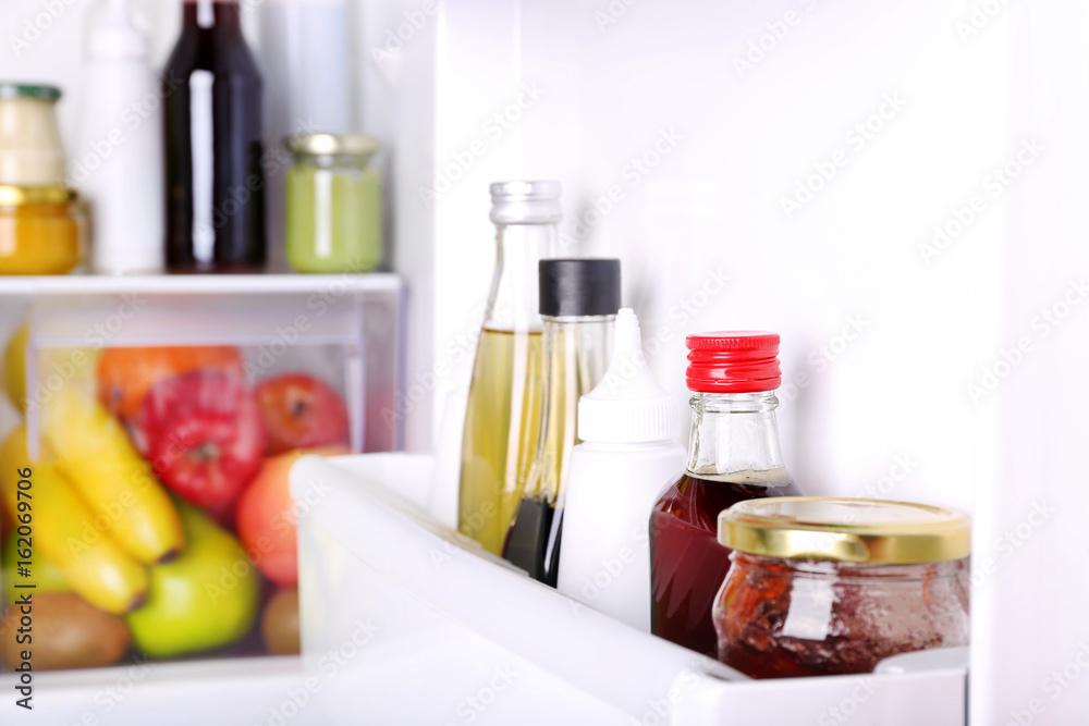 Many different sauces in fridge Many different sauces in fridge