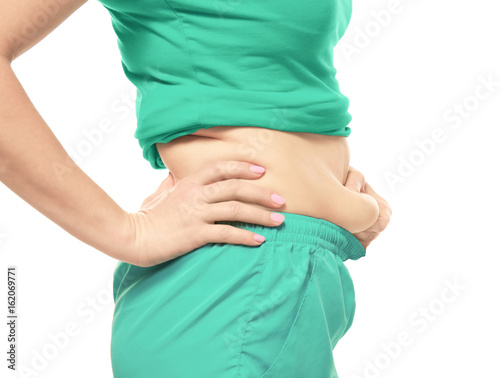 Mature woman in sportswear on white background, closeup. Weight loss concept