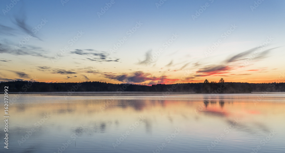 Beautiful midsummer night in Finland next to lake