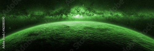 Valokuva exotic alien planet lit by a green star